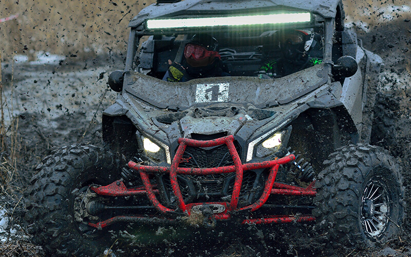 Vehicle off-roading through mud